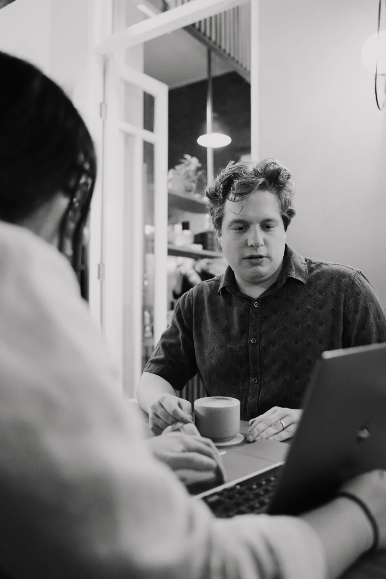 Justin Hardy in conversation with a client