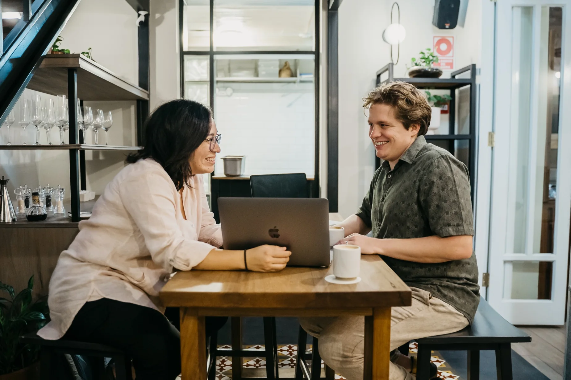 Justin and Abigail Hardy collaborating at a cafe